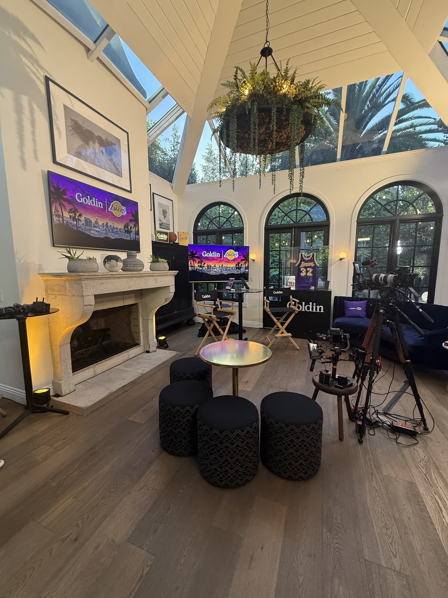 California special-event room with memorabilia displays, branded screens and seating.